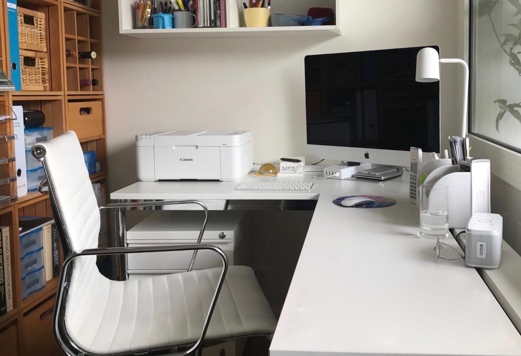 office desk and chair with computer but no people