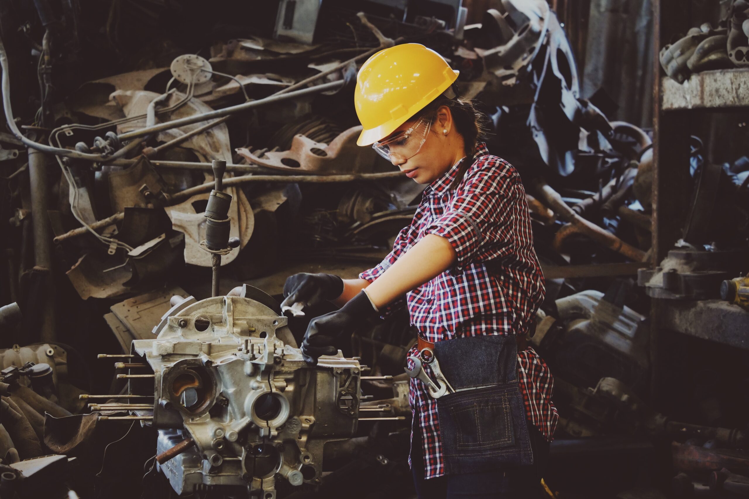 worker fixing broken machine